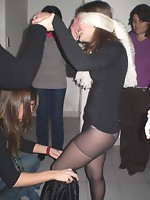 Amateur girls in pantyhose on a crazy party lifts their legs up