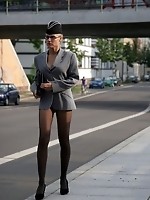 Sandra shows off in black seamless pantyhose outdoors